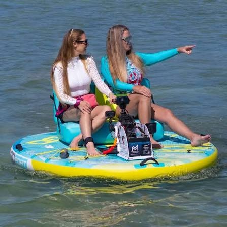Two girlfriends enjoying a day on the water with a Go Boat double Freedom.