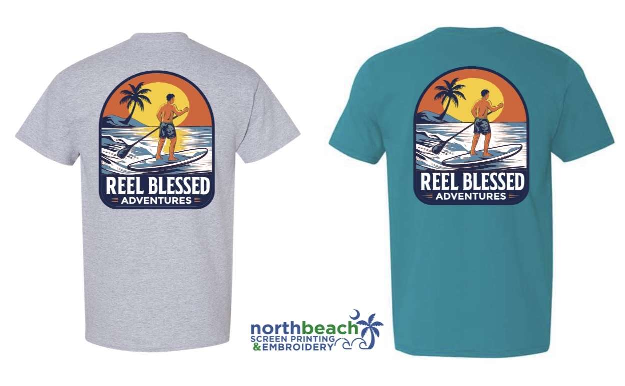 A T shirt design featuring a guy standing in a paddle board going directed towards a sunset with a palm tree to the left.